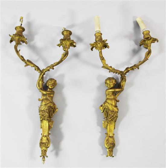 A pair of French Louis XV style ormolu twin branch wall lights, L.26in.